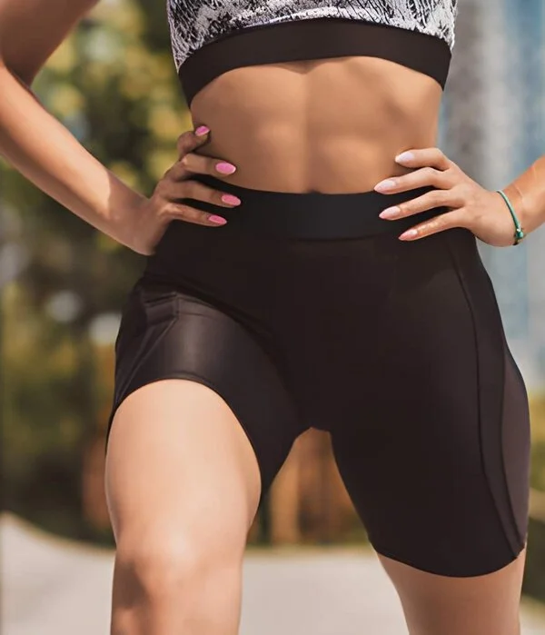 female wearing black fitness short