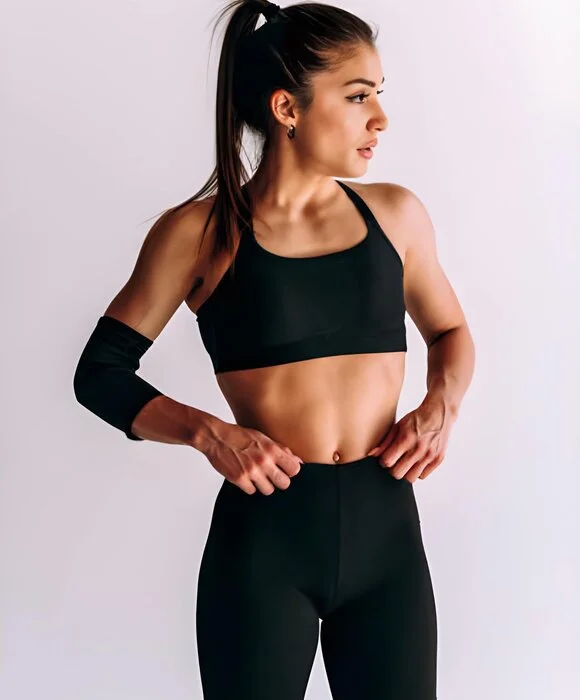 female wearing fitness short light background designed by Humex Apparel