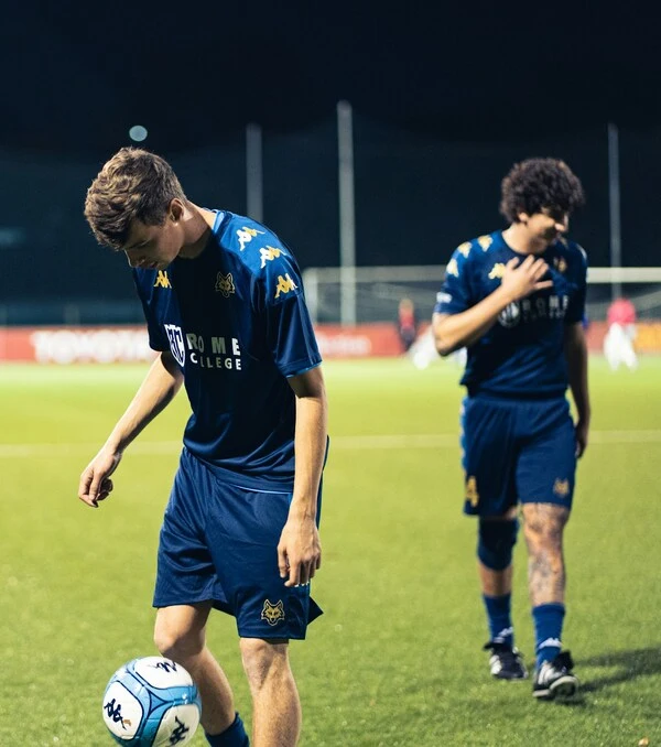 player playing soccer wearing blue color uniform